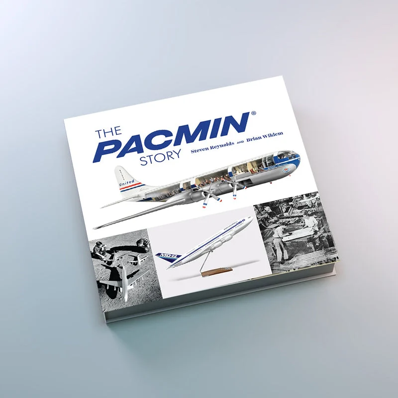 The Pacmin Story hardcover with the Regular Release dust jacket, showing a cutaway United Airlines propeller airliner model on a white cover
